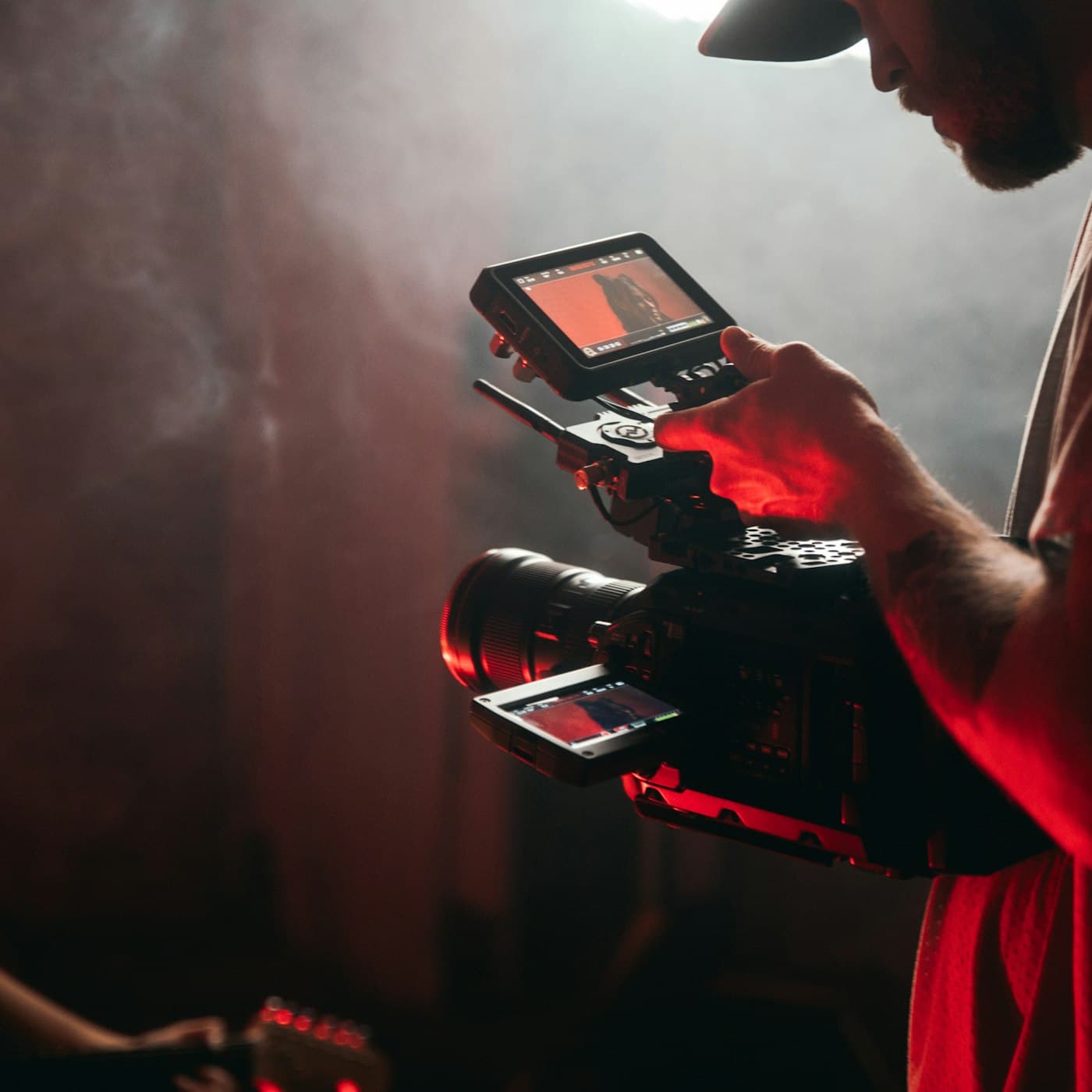 Cinematographer filming with a professional cinema camera on set